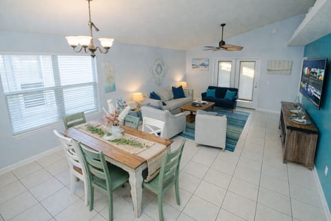 Dining Area: Bright and airy space, perfect for gatherings with ocean-themed decor and views!