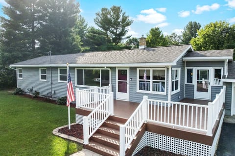 Welcoming Entrance: Step onto the stylish deck and into your Traverse City getaway adventure!
