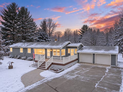 Welcoming Entrance: Step onto the stylish deck and into your Traverse City getaway adventure!