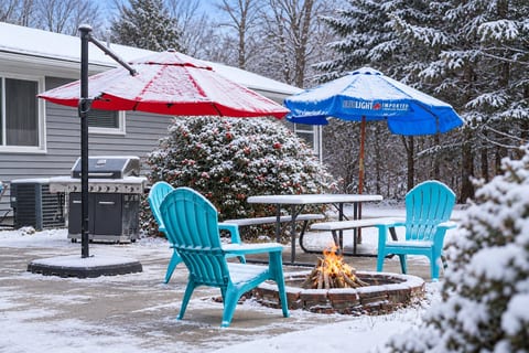 Outdoor Lounge: Bright umbrellas shade a fabulous firepit, perfect for s'mores and starry nights!