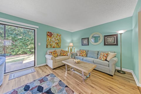 Living Room: Vibrant hues and inviting decor create the perfect retreat after a day in the sun!
