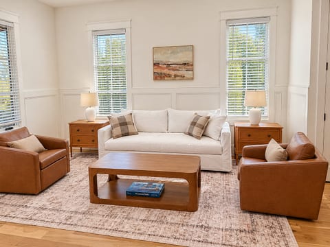 Bright, stylish living room with cozy seating and abundant natural light