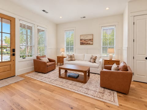 Bright, stylish living room with natural light and cozy seating