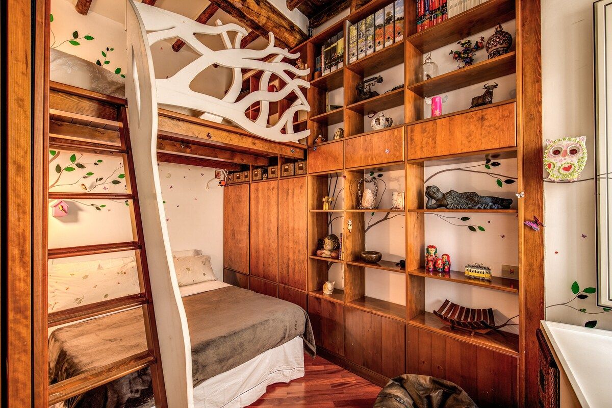 The bedroom number 2 with a double bed and one more double bed on the mezzanine