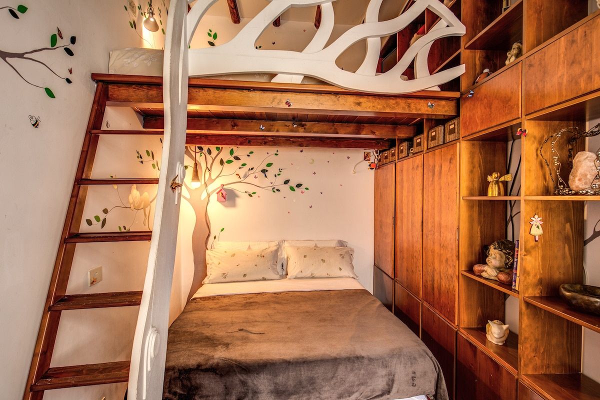 The bedroom number 2 with a double bed and one more double bed on the mezzanine