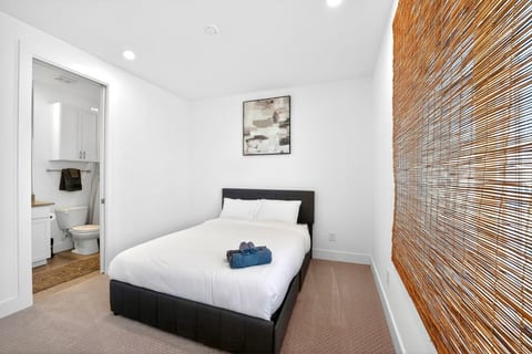 Bright, cozy bedroom with ensuite bath and clean modern style