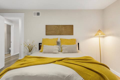 Bedroom 1 with comfortable queen bed and relaxing atmosphere