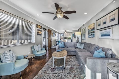 Living room with ample, comfortable seating. 