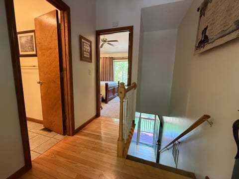 A look at the condo's two-level layout—the bedroom and bathroom are upstairs, with the living room, kitchen, dining area, and deck access downstairs.