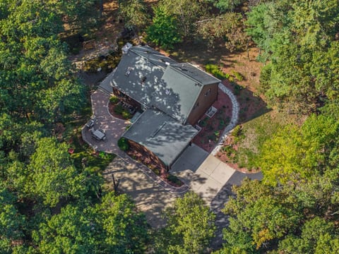 Secluded woodland retreat with wraparound patio and private driveway