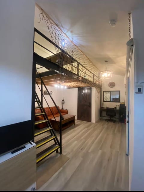 Beach theme Industrial Loft with Home Theater image 3
