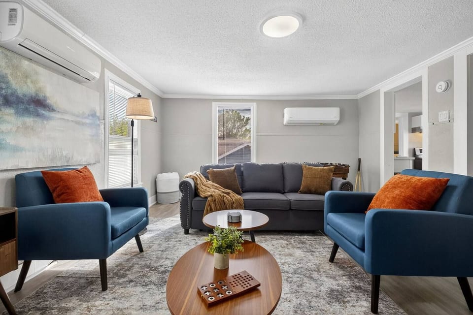 Make yourself at home in this spacious living area, ideal for relaxing, socializing, or playing games.