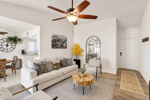 Bright open living room with vaulted ceilings and stylish cozy seating