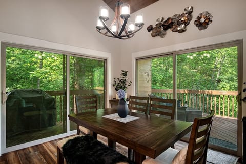 Dining room table seats 6 easily, or expands to seat 8. Gas grill outside.