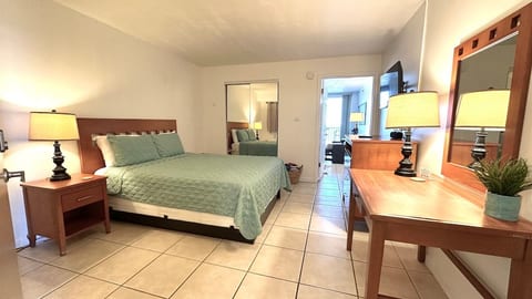Private one-bedroom with a door separating it from the kitchen and living area for added comfort and privacy.