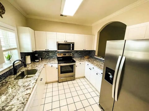 Where Culinary Wonders Unfold: A Sleek and Well-Equipped Kitchen