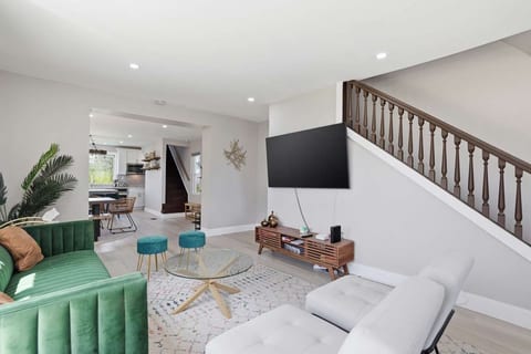 Bright, modern living area featuring a Smart TV and our NEX gaming system—perfect for tournament nights!