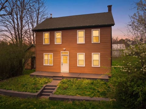 Cozy two-story farmhouse at sunset, private setting and big yard