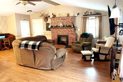 Escape to our cozy living room, where you can cozy up by the fireplace and enjoy a cup of hot cocoa.