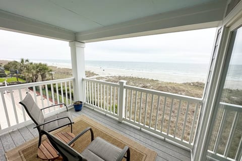 Escape to our breathtaking balcony with mesmerizing ocean views. Feel the gentle sea breeze on your skin as you relax on comfortable lounge chairs.