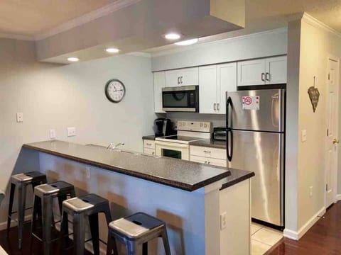 Kitchen with large breakfast bar.