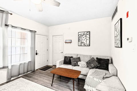 Welcome to your cozy retreat! Relax on the comfortable sectional sofa with a soft blanket and throw pillows. Watch a show on the TV or enjoy a book in the bright, inviting living area.