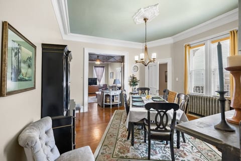 Host family dinners in a bright dining room filled with charm.