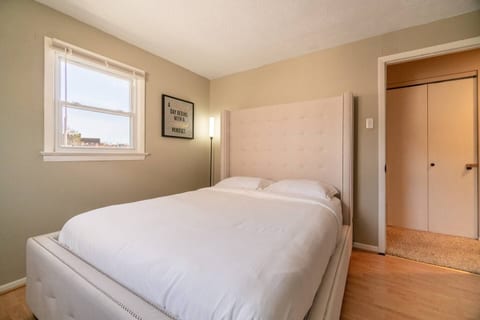 Queen size bed and a lamp with adjustable light settings for your liking.