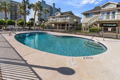 Relax in your own coastal retreat, just a walk away from the beach. This cottage features a sparkling pool for you to cool off in and unwind. Enjoy the ocean breeze from the patio or lounge by the pool after a day of fun in the sun.