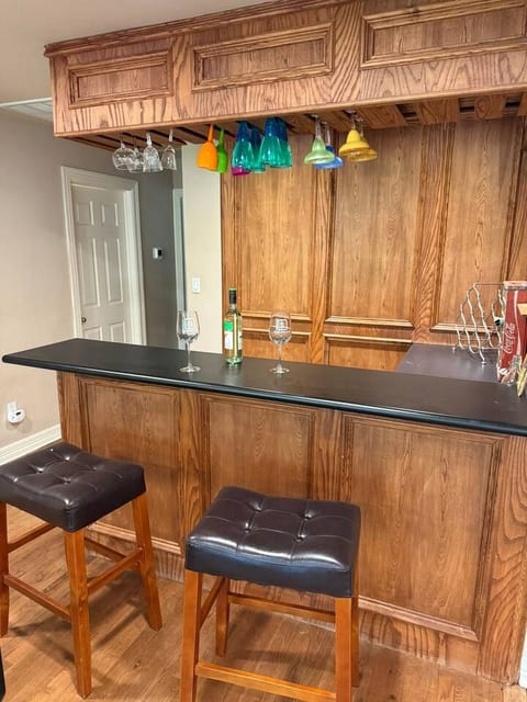 The home features a private bar area for you to enjoy. Sit on the comfortable leather stools and unwind with a drink after a day of exploring.