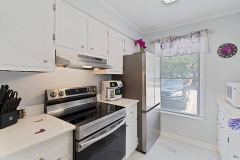 Welcome to a kitchen with all the essentials you need to prepare meals during your stay. Enjoy the modern appliances, ample counter space, and a bright atmosphere to start your day right.