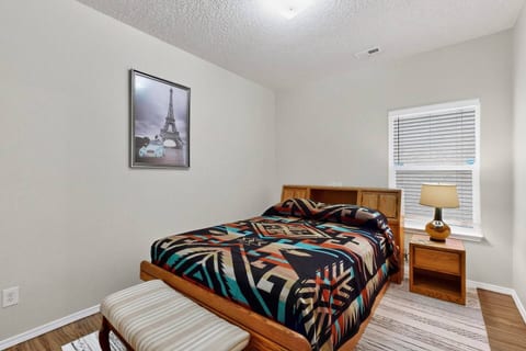 Welcome to your cozy retreat! You'll find a comfortable bed with a unique Southwestern-style blanket and a charming lamp for warm, ambient lighting. The space is ready for you to relax and unwind after a day of exploring.


