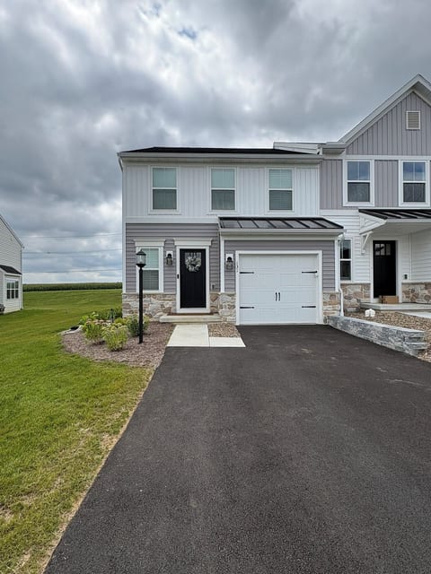 Single car garage which stores grill and other gear. Lighted walkway & exterior