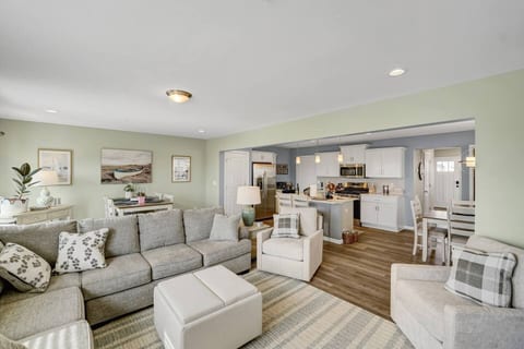 Seaside inspired colors brighten the living room kitchen and first floor