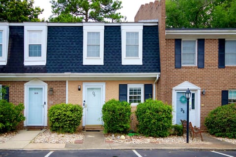 Charming brick townhouse with private entry and neat curb appeal