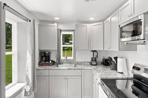 Bright modern kitchen with stainless appliances and ample prep space