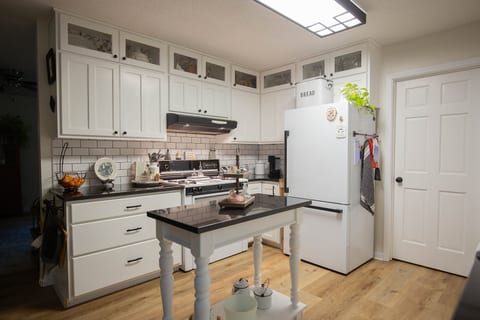 Bright farmhouse-style kitchen with island and ample storage