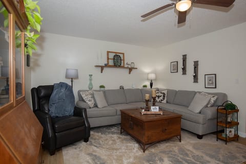 Cozy living room with spacious sectional and warm, inviting decor
