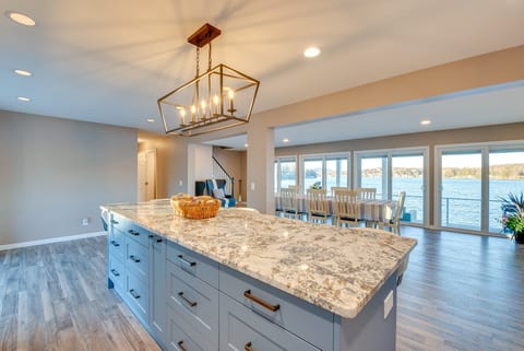 Spacious waterfront kitchen with oversized island and panoramic views