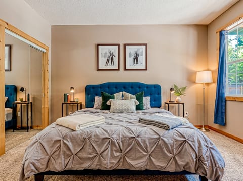 Chic Bedroom Retreat: Enjoy plush bedding and serene views in this stylish sanctuary.