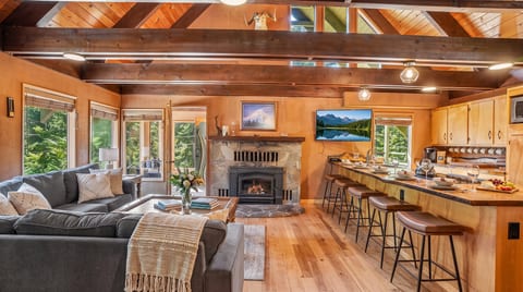 Living Room: Stylish retreat with stunning views, warm fireplace, and inviting decor awaits you!