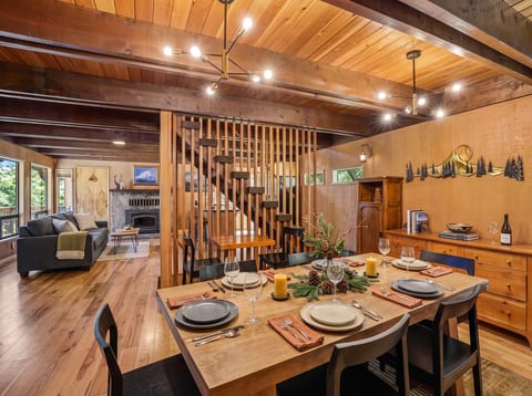Dining and Living Area: Enjoy meals by the fireplace and unwind with stunning mountain views!