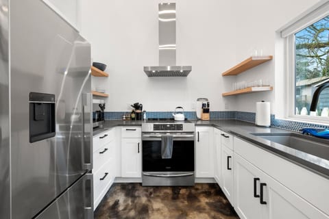 Fully equipped kitchen with coffee bar.