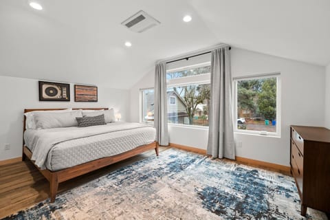 Bedroom Retreat: Bright and airy space with stylish decor and serene garden views!
