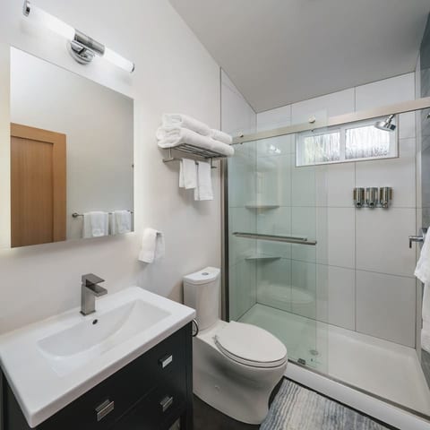 Modern Bathroom: Enjoy a bright, stylish retreat with a sleek shower and fluffy towels!
Towels and Soap provided.