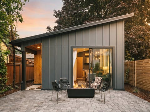 Dwell is a beautiful modern guest house with a fenced yard and patio with fire pit.