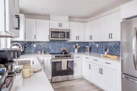 Kitchen Delight: Whip up culinary masterpieces in this stylish, modern space with stunning accents!