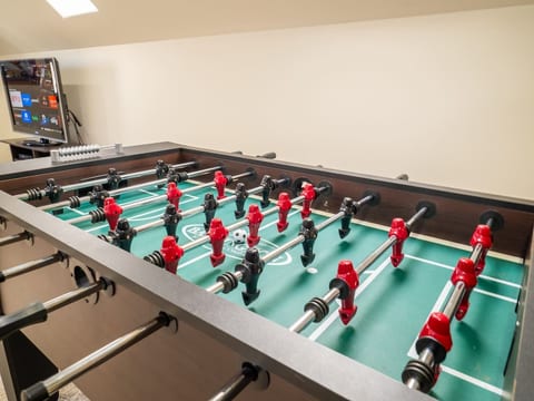 Game Room: Dive into endless fun with foosball and gaming beats! Perfect for friendly competitions!