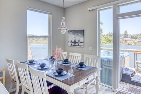 Dining Room: Bright space with river views, perfect for meals and laughter with loved ones!