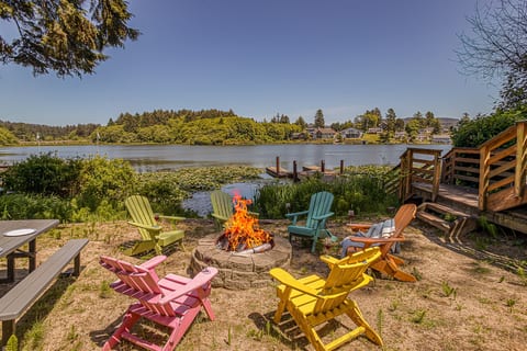 Fire Pit Retreat: Gather around the vibrant fire pit, sip drinks, and soak in stunning water views!